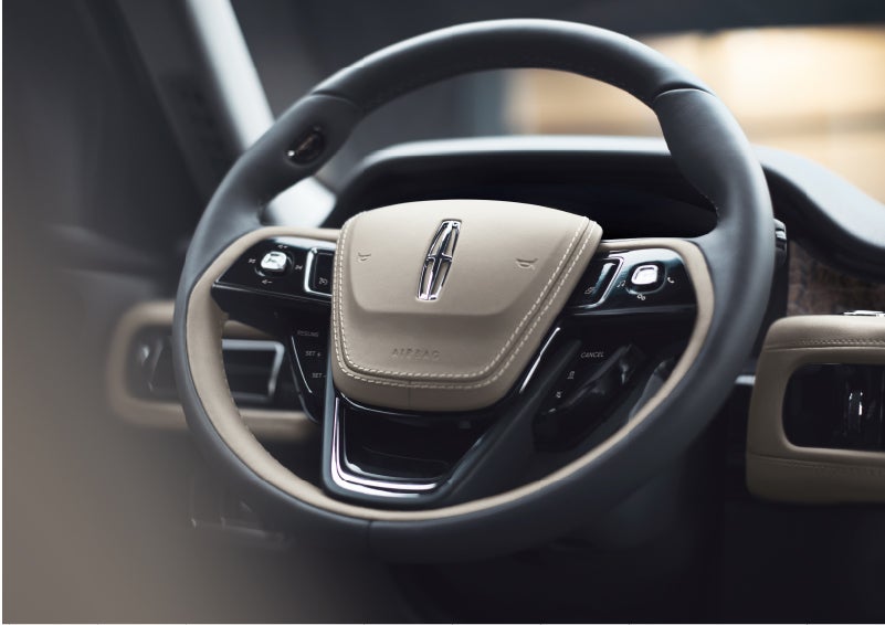 The intuitively placed controls of the steering wheel on a 2023 Lincoln Aviator® SUV | Hines Park Lincoln in Plymouth MI