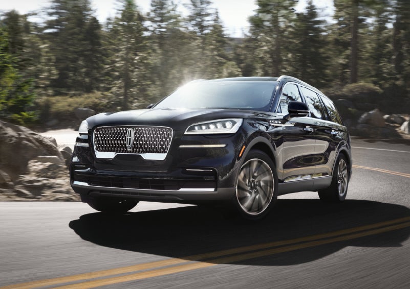 A Lincoln Aviator® SUV is being driven on a winding mountain road | Hines Park Lincoln in Plymouth MI