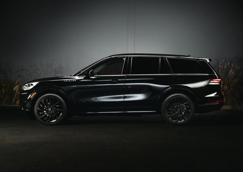 A 2024 Lincoln Aviator® SUV is shown in the Infinite Black exterior color | Hines Park Lincoln in Plymouth MI