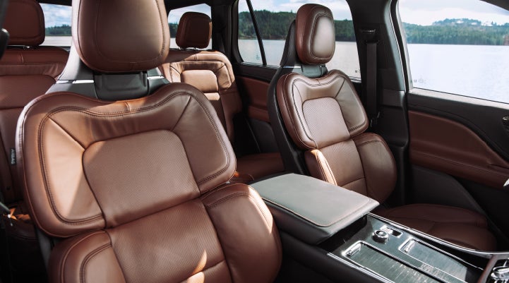 The front row's Perfect Position Seats in a 2024 Lincoln Aviator® Reserve model with Ebony Roast interior | Hines Park Lincoln in Plymouth MI
