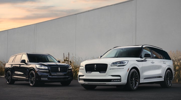 Two Lincoln Aviator® SUVs are shown with the available Jet Appearance Package | Hines Park Lincoln in Plymouth MI