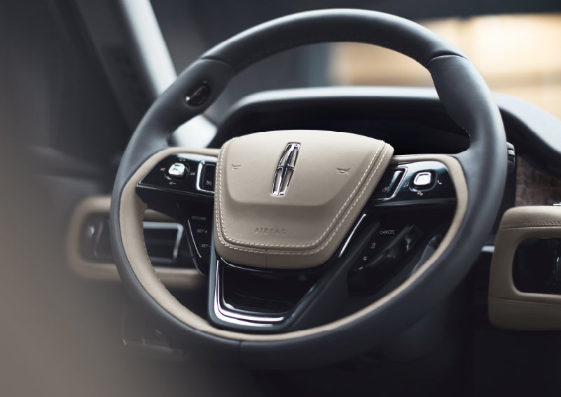 The intuitively placed controls of the steering wheel on a 2024 Lincoln Aviator® SUV | Hines Park Lincoln in Plymouth MI