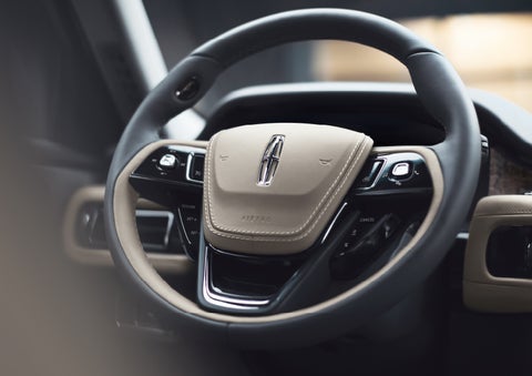 The intuitively placed controls of the steering wheel on a 2024 Lincoln Aviator® SUV | Hines Park Lincoln in Plymouth MI
