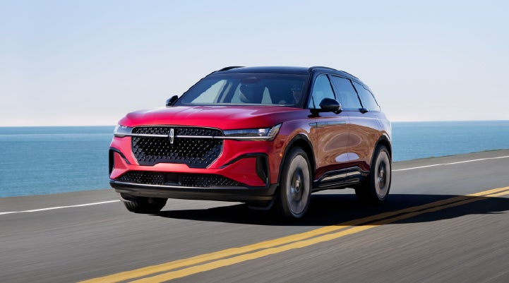 A 2025 Lincoln Nautilus® SUV is being driven on a seaside roadway. | Hines Park Lincoln in Plymouth MI