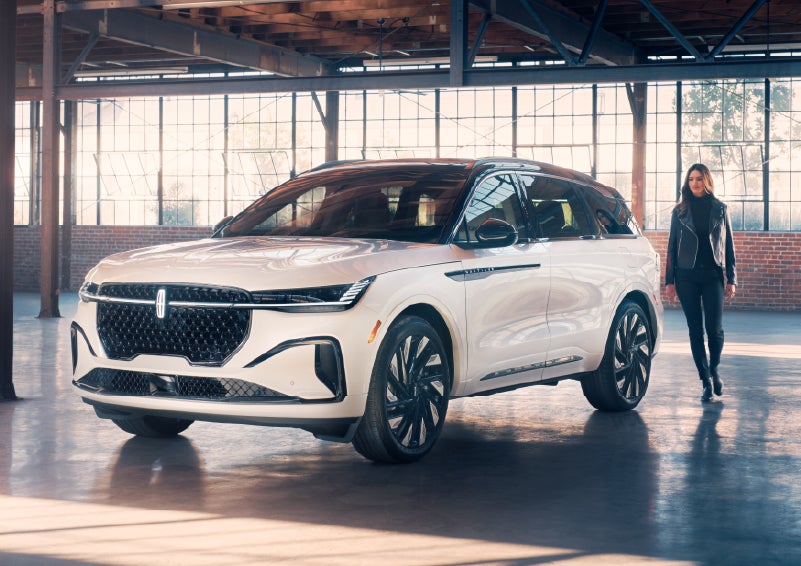 A person approaches a 2025 Lincoln Nautilus® SUV. | Hines Park Lincoln in Plymouth MI