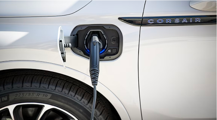 An electric charger is shown plugged into the charging port of a Lincoln Corsair® Grand Touring
model. | Hines Park Lincoln in Plymouth MI