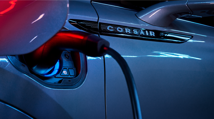 A charger plugged into the charging port of a 2025 Lincoln Corsair® Plug-in Hybrid model. | Hines Park Lincoln in Plymouth MI