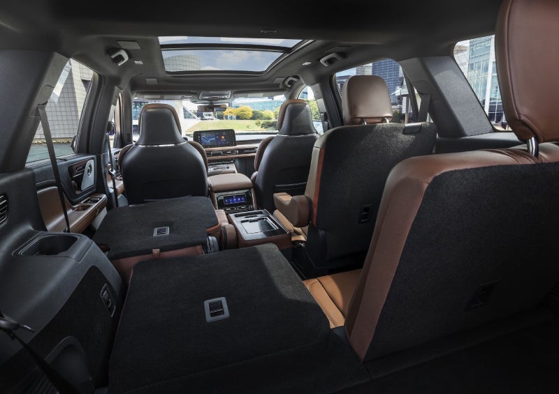 One side of the PowerFold® third-row seat and a second-row seat are folded forward in the 2026 Lincoln Aviator® SUV. | Hines Park Lincoln in Plymouth MI