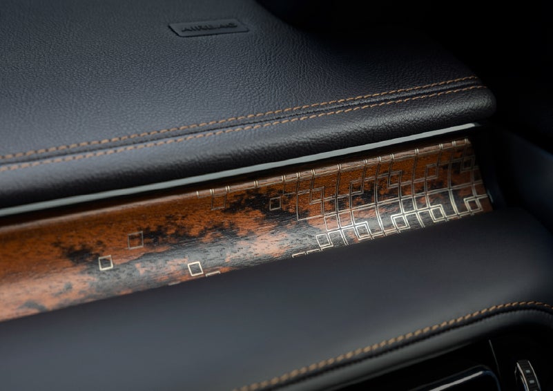 A close-up shot of the 2026 Lincoln Aviator® dashboard with unique black and brown accents and brown stitching. | Hines Park Lincoln in Plymouth MI