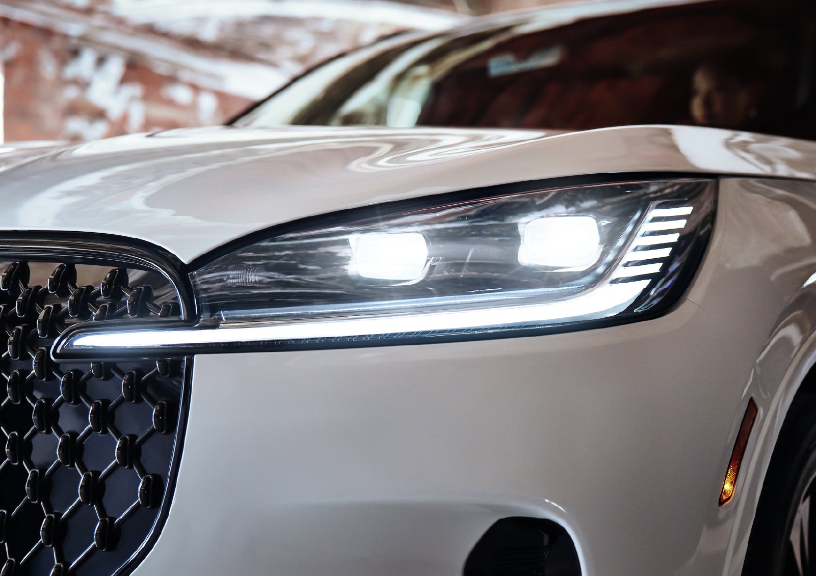 A close-up of a headlamp on the 2027 Lincoln Aviator® SUV is shown. | Hines Park Lincoln in Plymouth MI