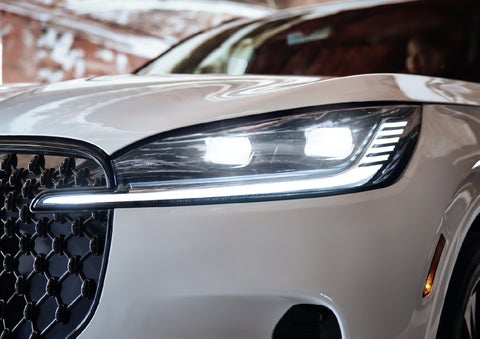 A close-up of a headlamp on the 2027 Lincoln Aviator® SUV is shown. | Hines Park Lincoln in Plymouth MI