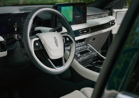 The leather-trimmed steering wheel of a 2027 Lincoln Aviator® Black Label™ SUV. | Hines Park Lincoln in Plymouth MI
