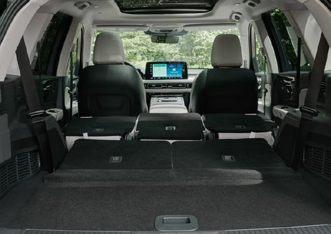 A rear to front view of the interior of a 2027 Lincoln Aviator® Black Label™ SUV shows the third and second rows folded flat | Hines Park Lincoln in Plymouth MI