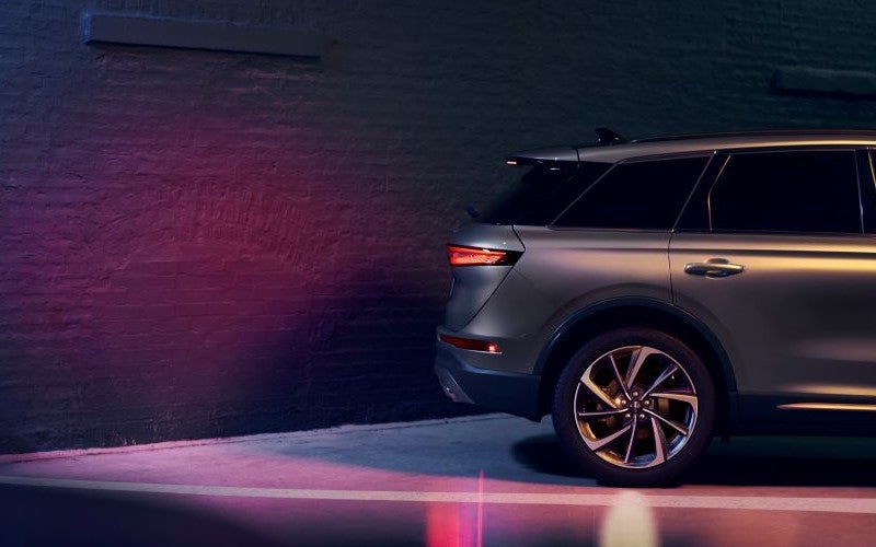 Back end of Lincoln Corsair parked with lights around it in What Kind of Gas Does My Lincoln SUV Need?