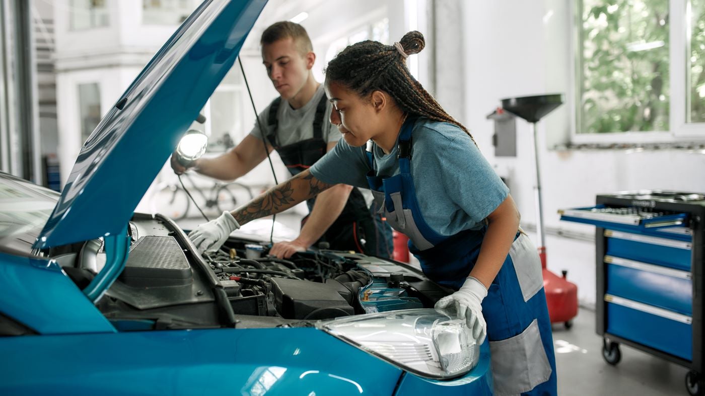 Lincoln Certified Technicians working on Lincoln vehicle in the Service Center